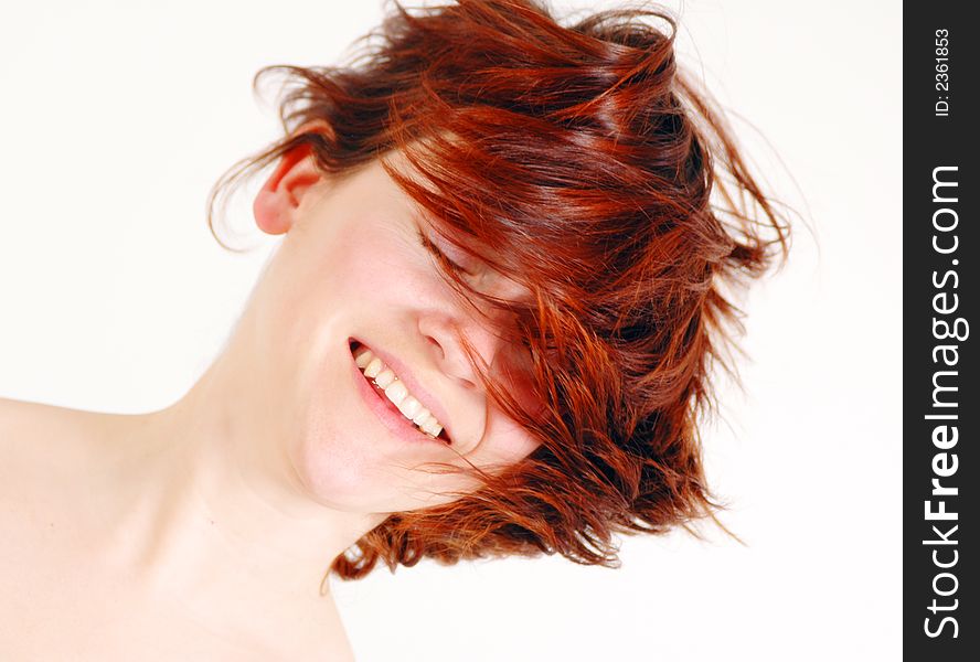 Red hair woman tossing her hair in movement. Red hair woman tossing her hair in movement