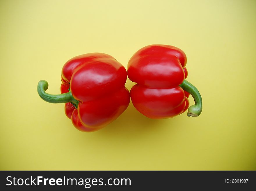 two red peppers on yellow, healthy diet, vegetables