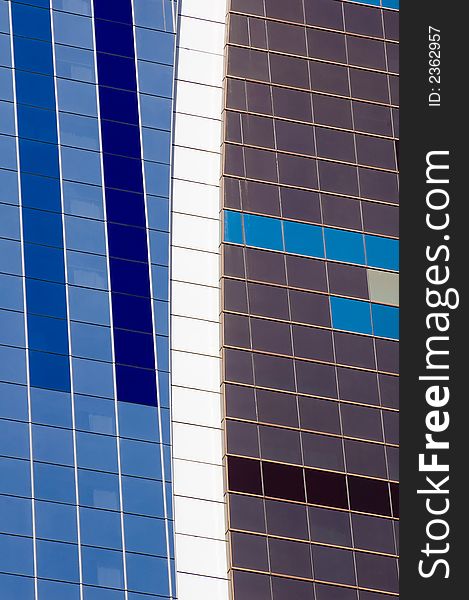 Building glass pattern showing square panels of glass in shades of blue and white