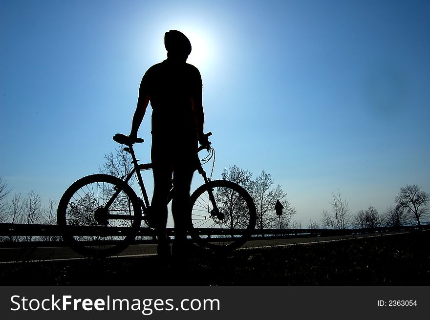 Photo of mountain biker silhouette. Photo of mountain biker silhouette.