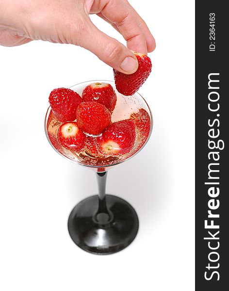 Fresh strawberries into champaign glass