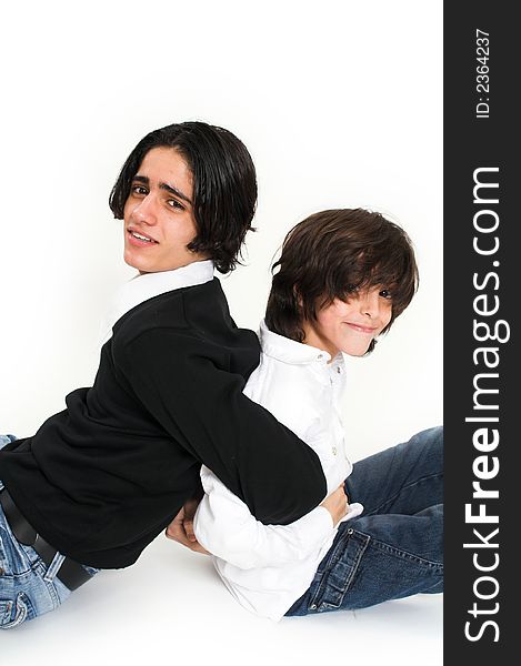 Brothers spending time and posing together over white background. Brothers spending time and posing together over white background