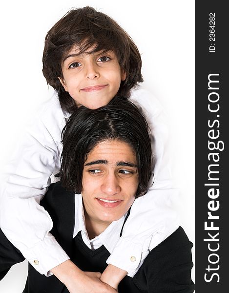 Brothers spending time and posing together over white background. Brothers spending time and posing together over white background