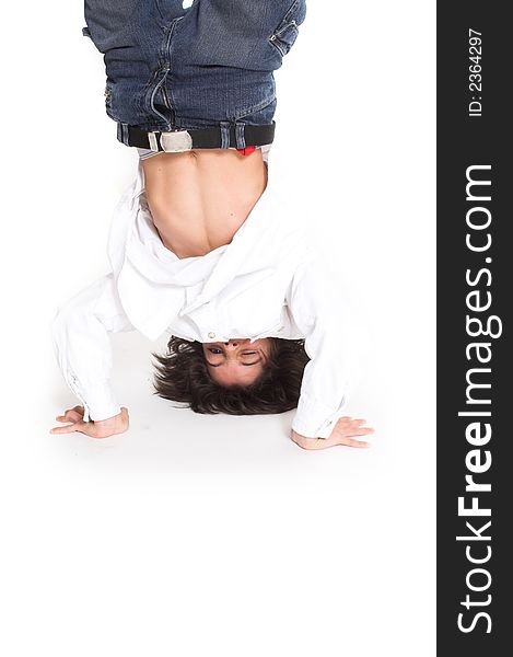 Teen up side down over white background. Teen up side down over white background
