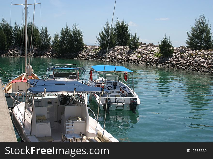 Boats are waiting for captains, tourists and guests in the harbor. Boats are waiting for captains, tourists and guests in the harbor.