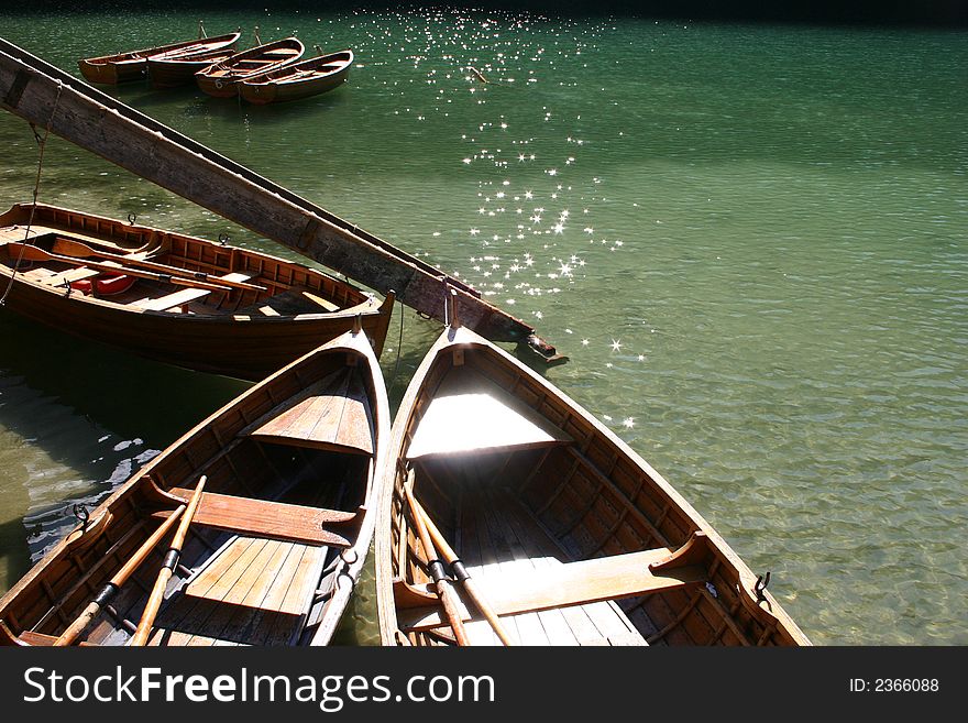 Rowing wooden boats on lake