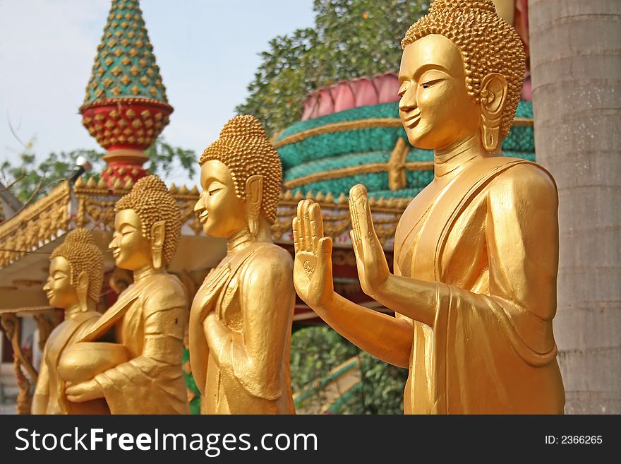 3 golden Buddhist statues with a narrow depth of field. 3 golden Buddhist statues with a narrow depth of field