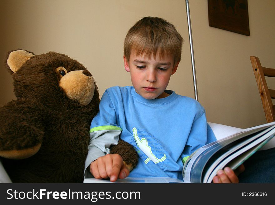 Little boy is reading interesting book. Little boy is reading interesting book