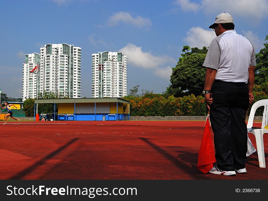 Flag man at the sport center