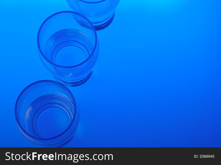 Liquid filled glasses with blue backlighting. Liquid filled glasses with blue backlighting.