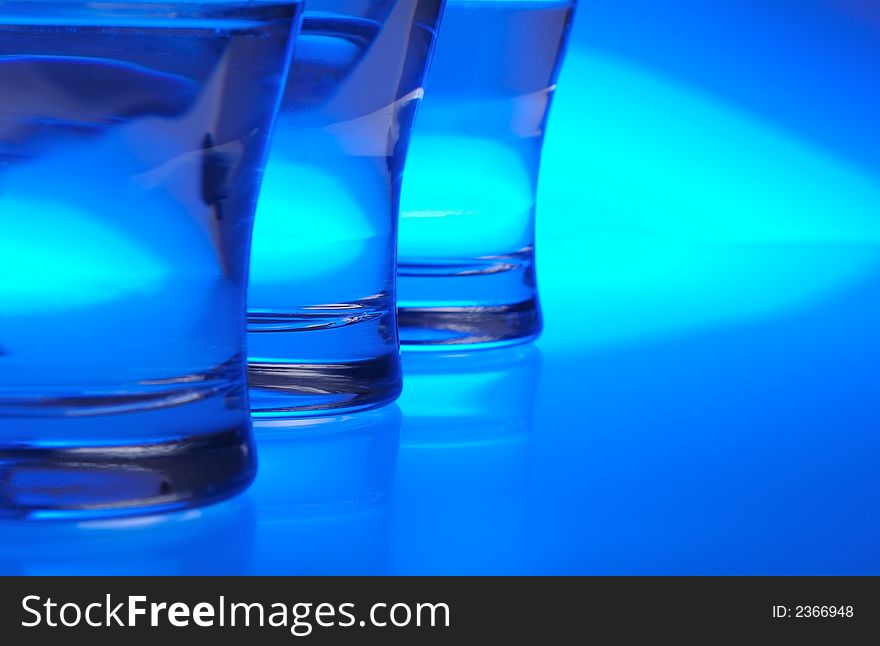Liquid filled glasses with blue backlighting. Liquid filled glasses with blue backlighting.