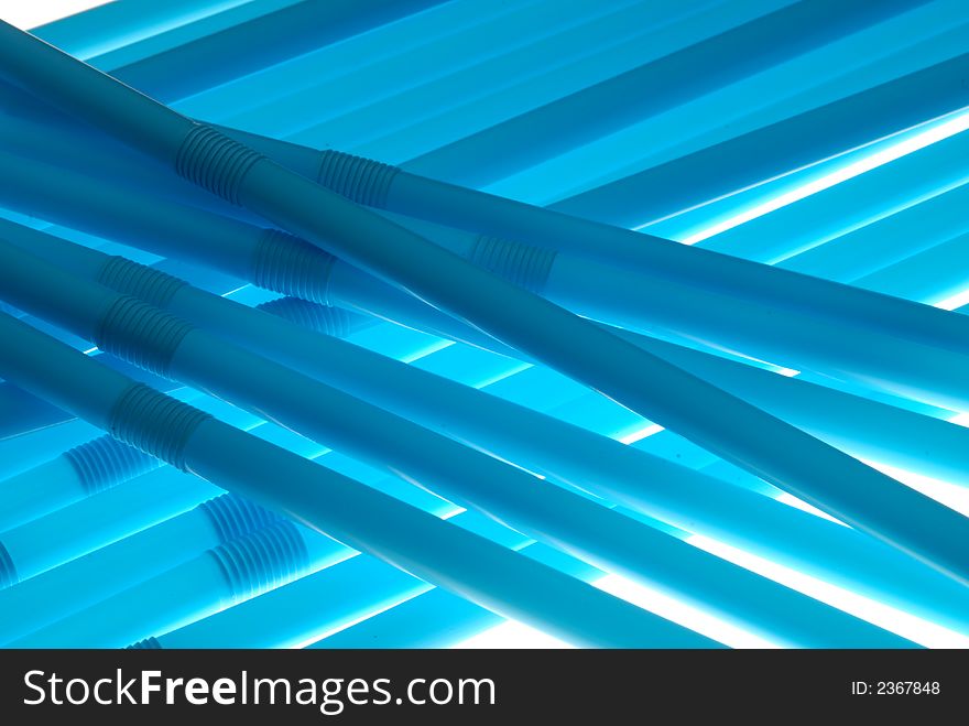 Blue drinking straw on white background