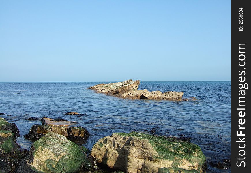 Early morning rocky beach scene. Early morning rocky beach scene