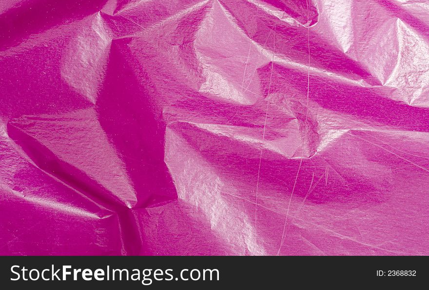 Pink crushed background. torn paper.