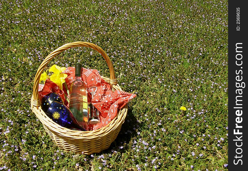 Bottle of wine in a picnic basket. Bottle of wine in a picnic basket