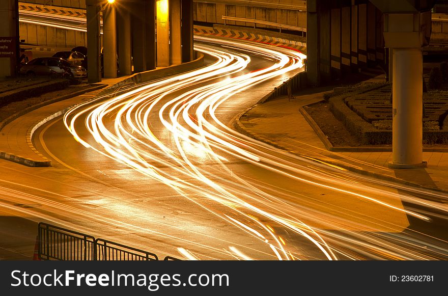 Lights on at night. In the city the car is running. Lights on at night. In the city the car is running.