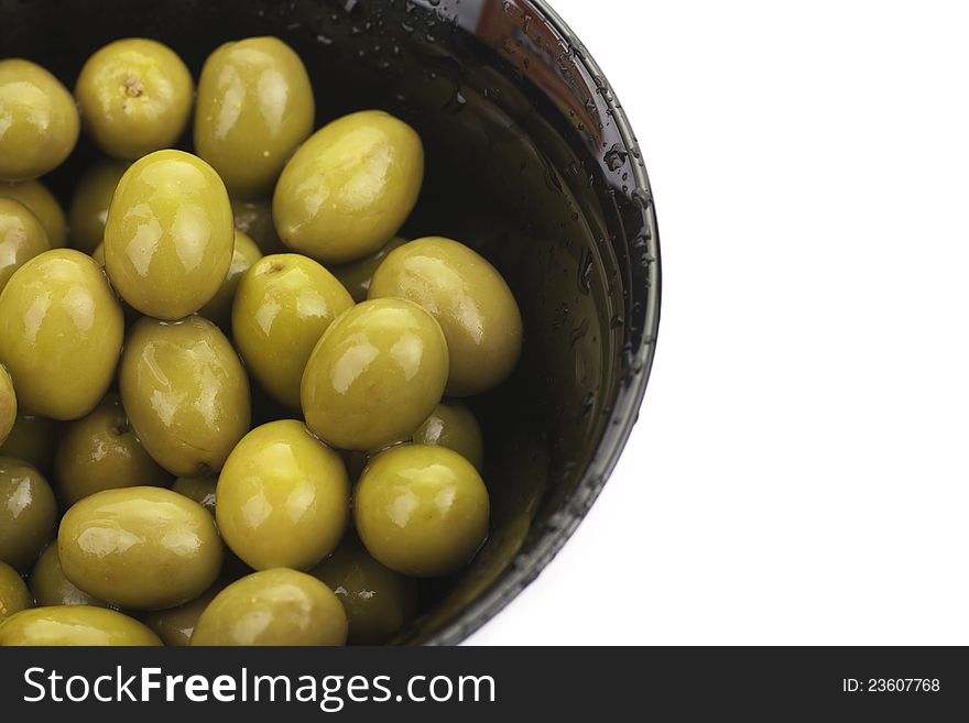 Pile Of  Green Olives In A Bowl Isolated