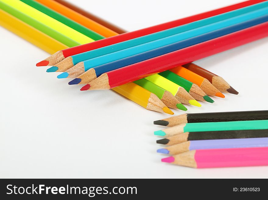 Aranged wooden color pens on white background. Aranged wooden color pens on white background