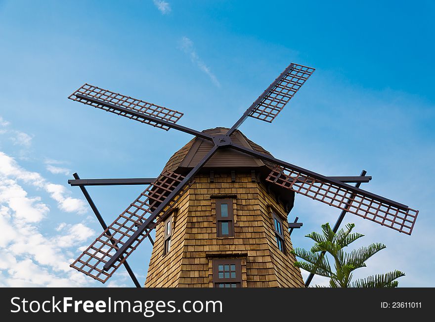 Windmill standing in the blue sky creating a nice aerial view. Windmill standing in the blue sky creating a nice aerial view.