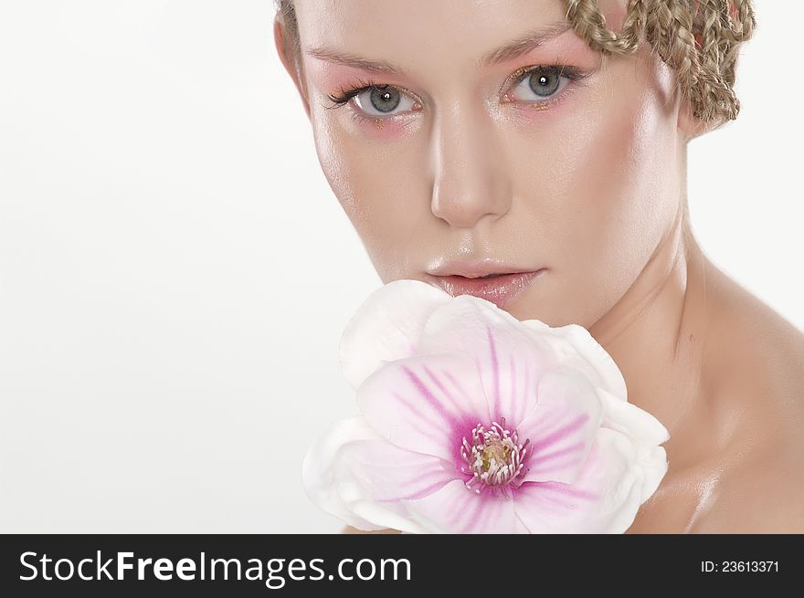 Beautiful young woman with lily flower