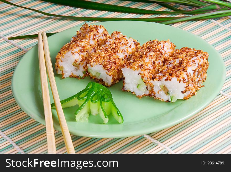 Sushi Rolls With Sesame Seeds, Avocado, Fish