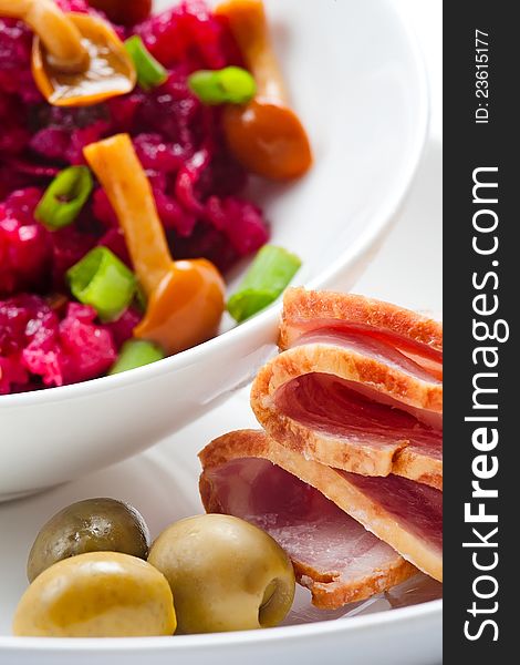 Ham olives and beet salad with mushrooms. Ham olives and beet salad with mushrooms