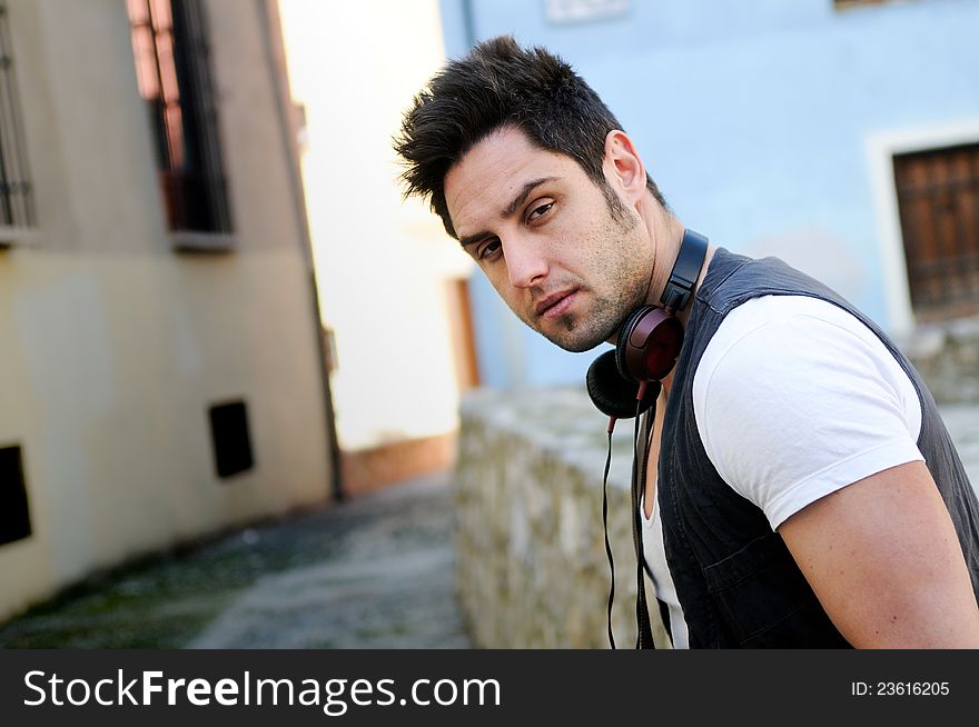 Portrait of young attractive man in urban background. Portrait of young attractive man in urban background