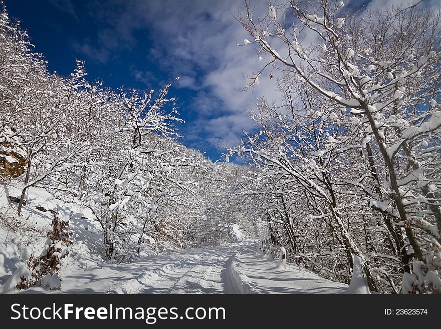 Snow-covered mountain road at the Ai-Petri mount, Ukraine. Snow-covered mountain road at the Ai-Petri mount, Ukraine