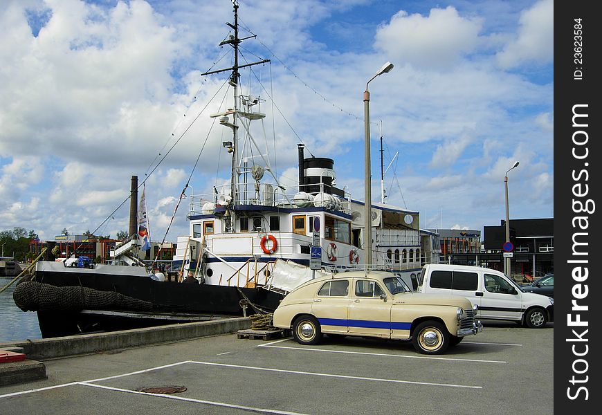 The old tugboat moored at a port