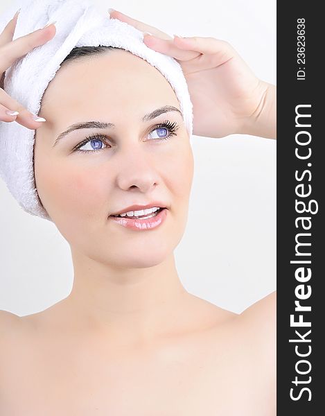 Beauty spa treatment woman wearing towel drying hair.
