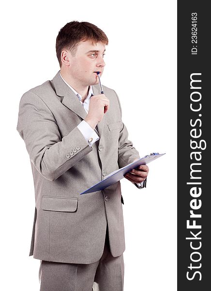 Thoughtful man with a pen on a white background. Thoughtful man with a pen on a white background
