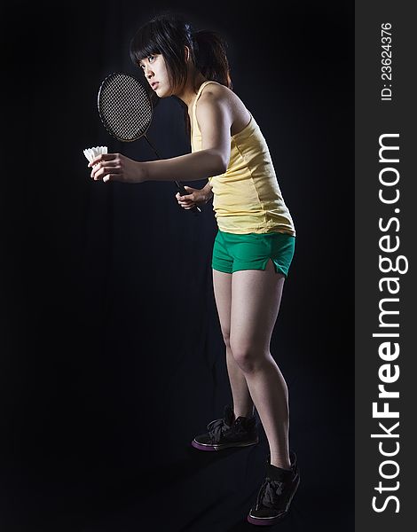 Asian woman with badminton racket