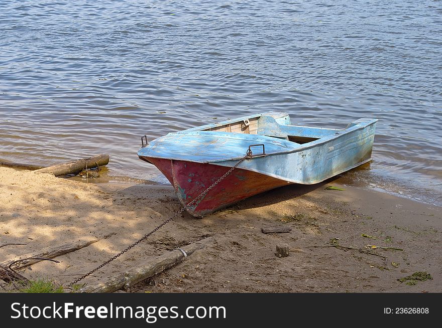 Metal Boat On The Riverbank