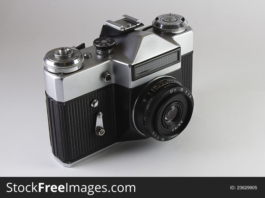 The Old Soviet SLR Camera On Grey Background