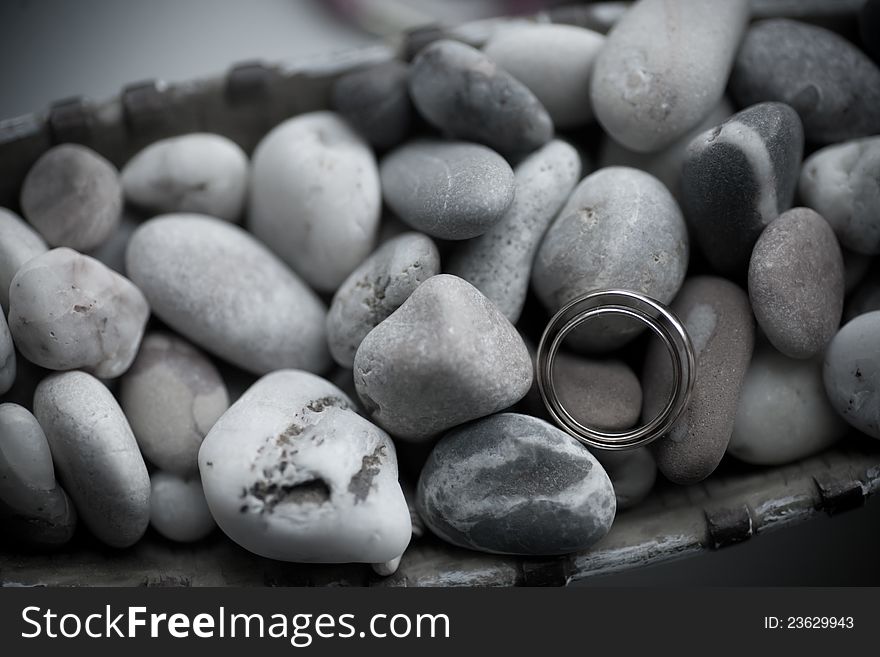 Wedding rings on see stones