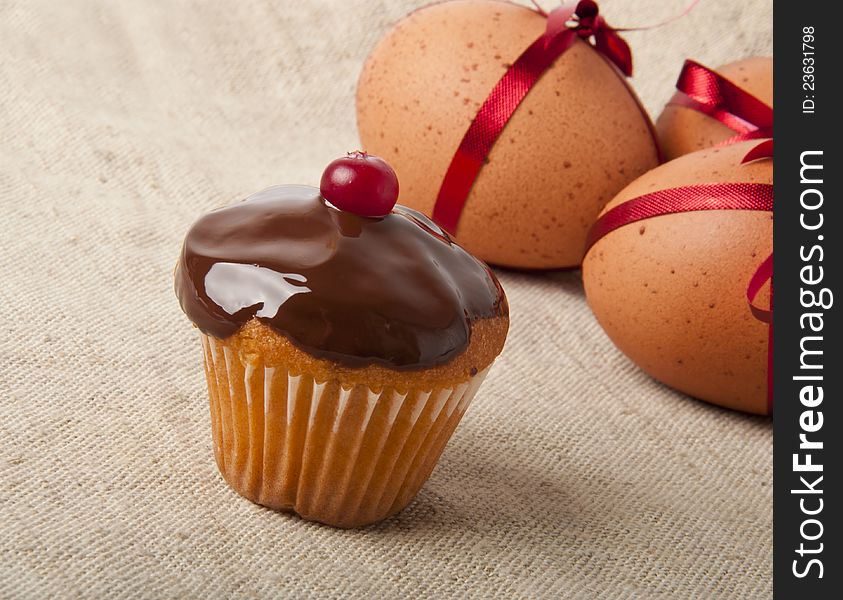 Cupcake with chocolate icing and Easter Eggs. Cupcake with chocolate icing and Easter Eggs