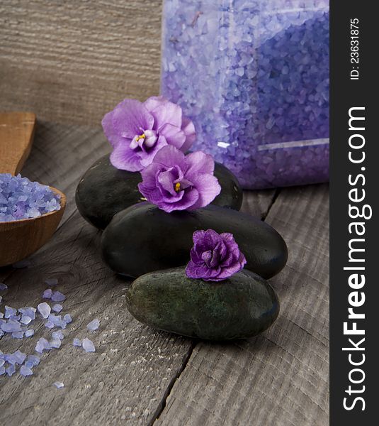 Spa stones with purple flowers