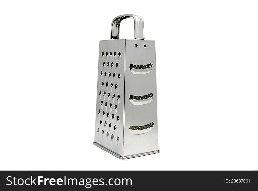 Metal grater for vegetables and fruit products on a white background