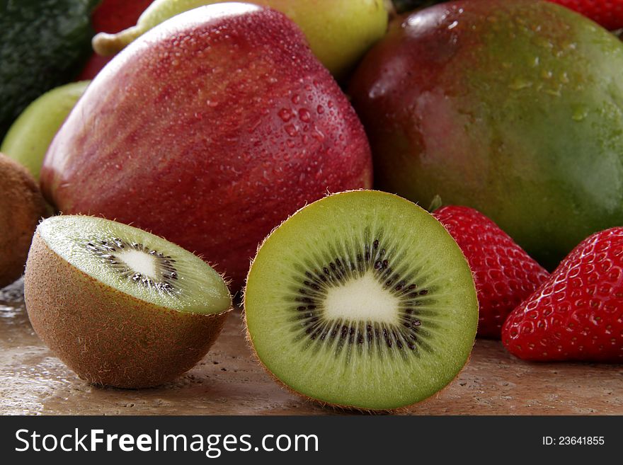 green kiwi on the stone table.  green kiwi on the stone table