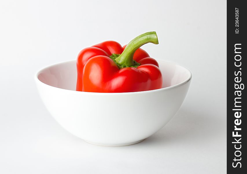 Fresh red Bulgarian pepper in a white bowl. Fresh red Bulgarian pepper in a white bowl