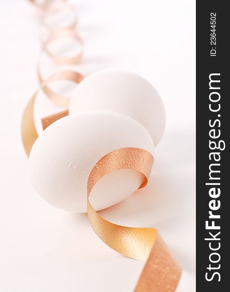 Two Eggs And A Golden Ribbon. Two Eggs And A Golden Ribbon