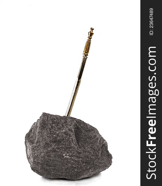 Medieval sword hammered in a stone on white background. Medieval sword hammered in a stone on white background