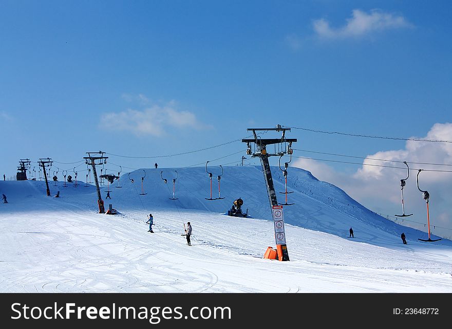 Skiers rising to the point of the start. Skiers rising to the point of the start