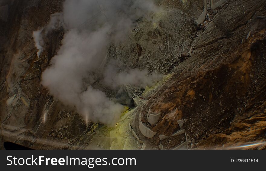 Egg-producing factory covered by sulphuric smoke in volcanic valley in Japan.