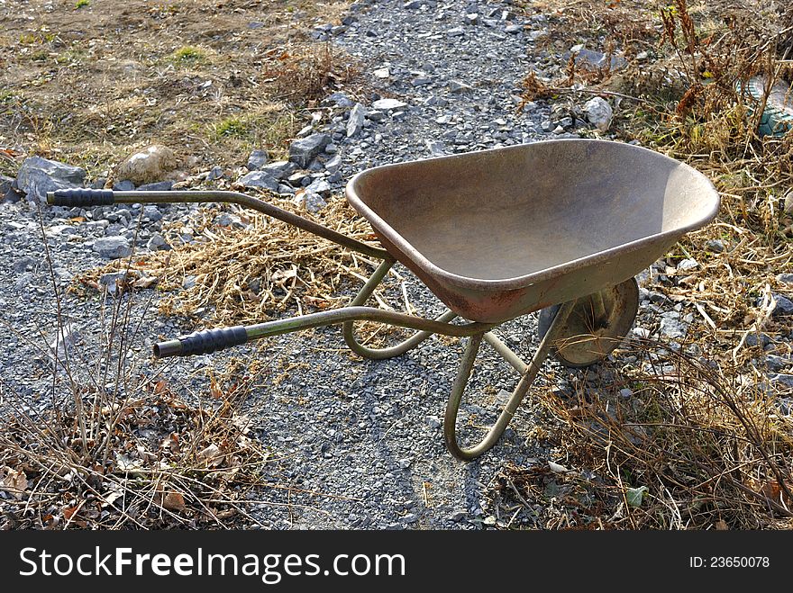 A hand barrow in the garden