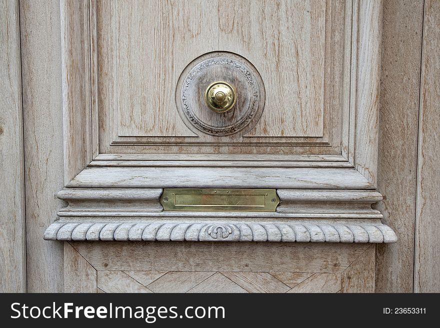 A classic mail box behind the door. A classic mail box behind the door.