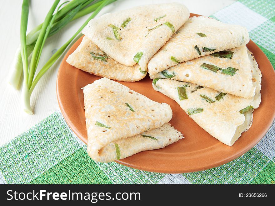 Wheat pancakes, fried with sliced green onions