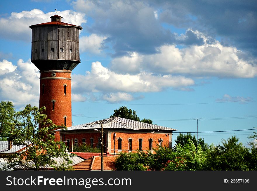 Water tower in sunny day. Blue sky