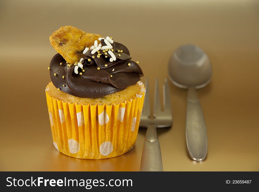 Nice Cupcake over gold background