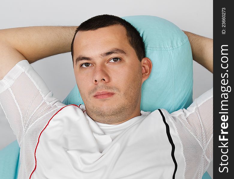 Man resting after exercises in gym